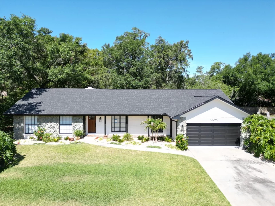 Front view of a home with a new asphalt shingle roof installed on a home in Riverview, Florida.